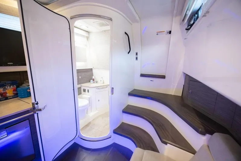Pachanga Yacht Photos Pics Luxurious interior of 2021 Boston Whaler 420 Outrage, featuring modern bathroom and sleek design.