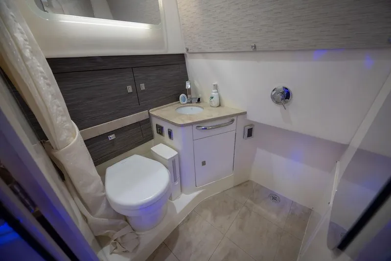 Pachanga Yacht Photos Pics 2021 Boston Whaler 420 Outrage bathroom with modern fixtures and elegant design.