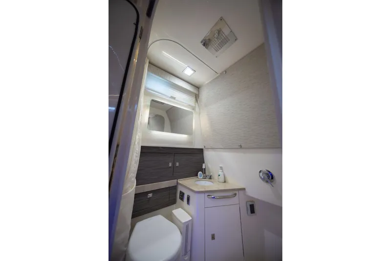 Pachanga Yacht Photos Pics 2021 Boston Whaler 420 Outrage bathroom with modern fixtures and sleek design.