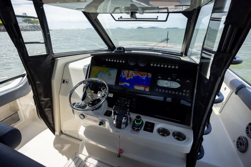 Pachanga Yacht Photos Pics 2021 Boston Whaler 420 Outrage helm with advanced navigation displays and controls.