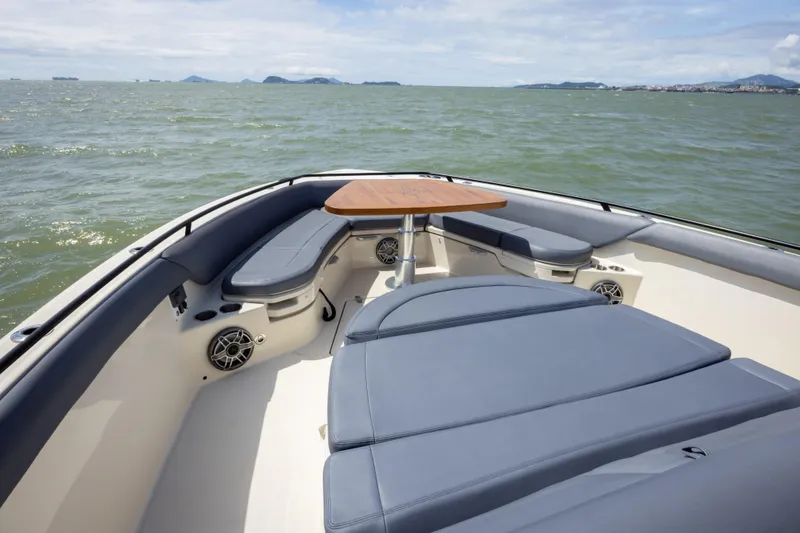 Pachanga Yacht Photos Pics 2021 Boston Whaler 420 Outrage boat interior with seating and table on open water.