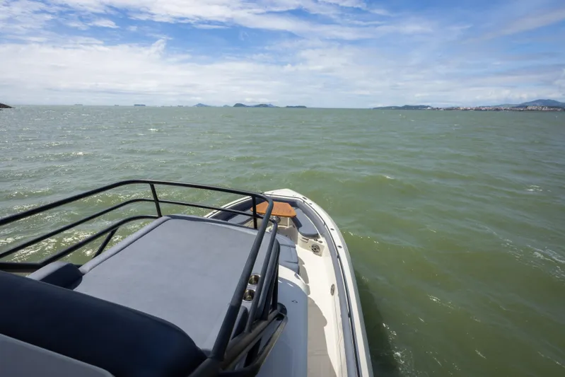 Pachanga Yacht Photos Pics Boston Whaler 420 Outrage 2021 cruising on open water under a clear sky.