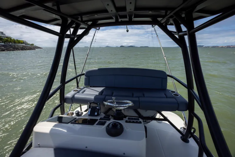 Pachanga Yacht Photos Pics Boston Whaler 420 Outrage 2021 helm view on open water, showcasing controls and seating.