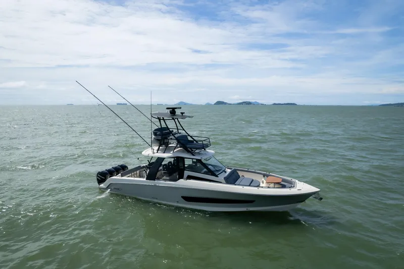Pachanga Yacht Photos Pics 2021 Boston Whaler 420 Outrage boat on open water under a clear sky.