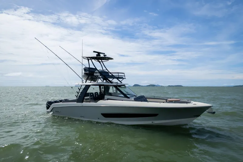 Pachanga Yacht Photos Pics 2021 Boston Whaler 420 Outrage boat on open water under blue sky.