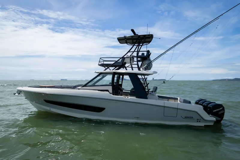 Pachanga Yacht Photos Pics 2021 Boston Whaler 420 Outrage boat on open water under blue sky.
