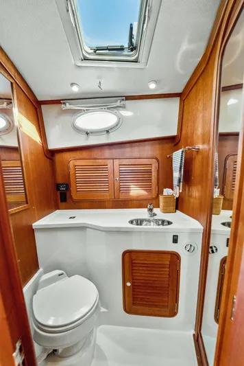 Skylark Yacht Photos Pics 2008 Hinckley Talaria 44 yacht bathroom with wooden accents and skylight.