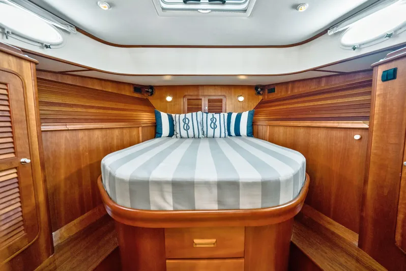 Skylark Yacht Photos Pics Luxurious 2008 Hinckley Talaria 44 yacht cabin with elegant wood finish and cozy bed.