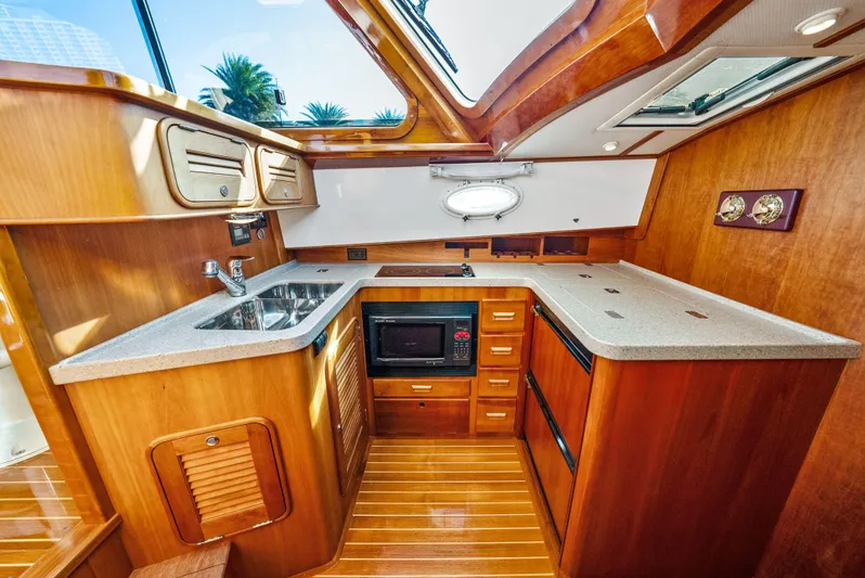 Skylark Yacht Photos Pics Luxurious 2008 Hinckley Talaria 44 yacht interior with elegant wooden kitchen design.