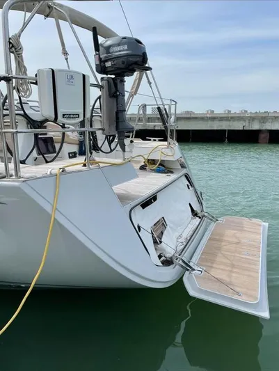 4850 Yacht Photos Pics Sailing yacht CNB BORDEAUX 60, 2013 model, with open swim platform in marina.