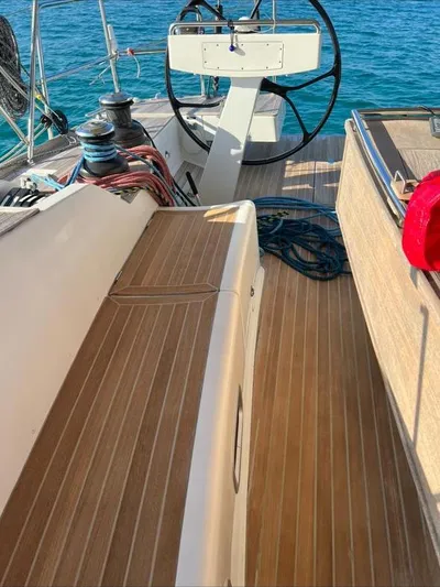 4850 Yacht Photos Pics Deck view of 2013 CNB BORDEAUX 60 yacht with steering wheel and ocean backdrop.