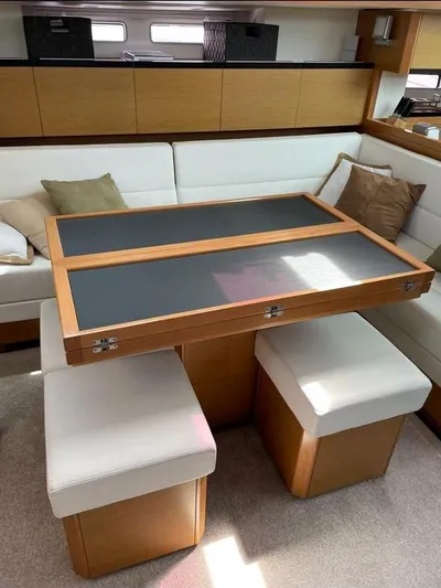 4850 Yacht Photos Pics Luxurious interior of 2013 CNB BORDEAUX 60 yacht with elegant seating and table.