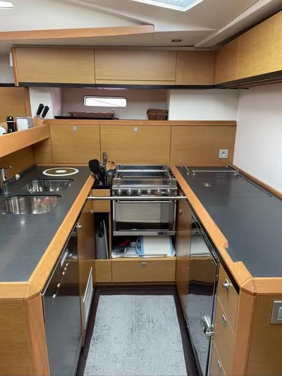 4850 Yacht Photos Pics Modern kitchen interior of 2013 CNB BORDEAUX 60 yacht with sleek countertops and appliances.