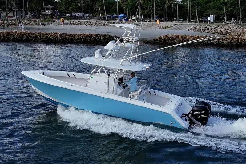 Poliseas Yacht Photos Pics 2006 Bahama 31 boat cruising on water with Mercury outboard engines.