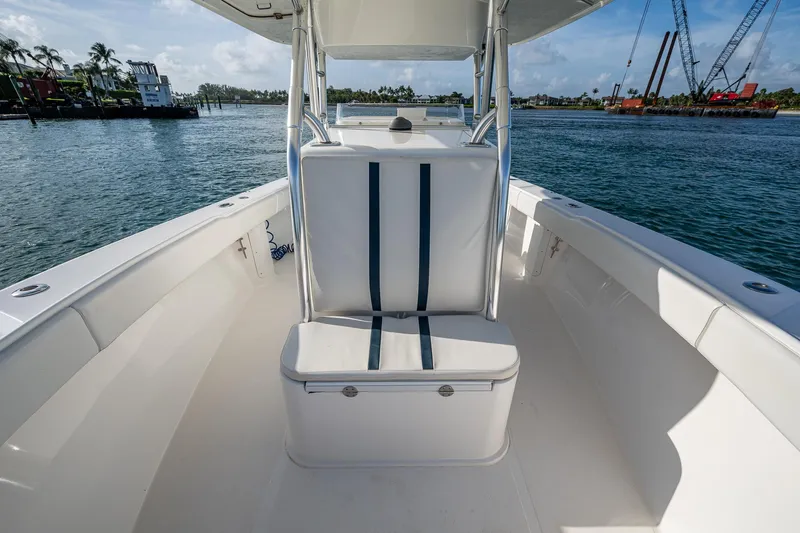Poliseas Yacht Photos Pics 2006 Bahama 31 boat interior with seating, on calm water, sunny day.