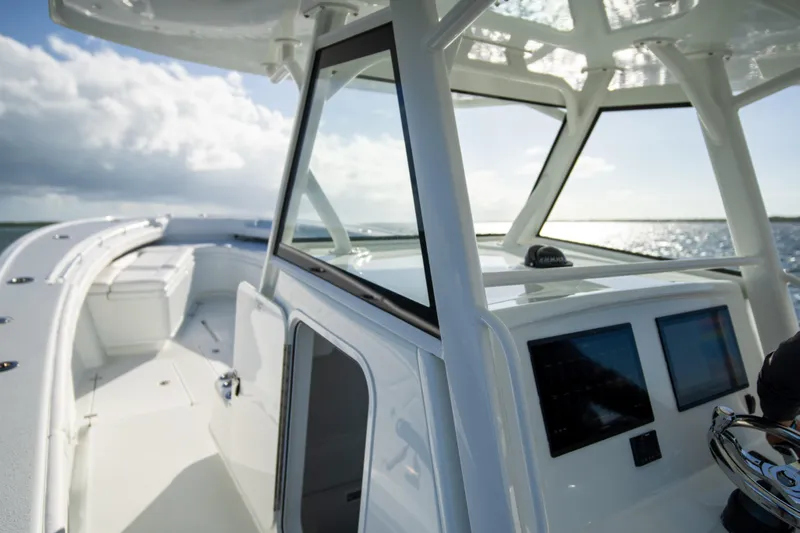  Yacht Photos Pics 2022 Yellowfin 39 Offshore boat with sleek design and modern cockpit on open water.