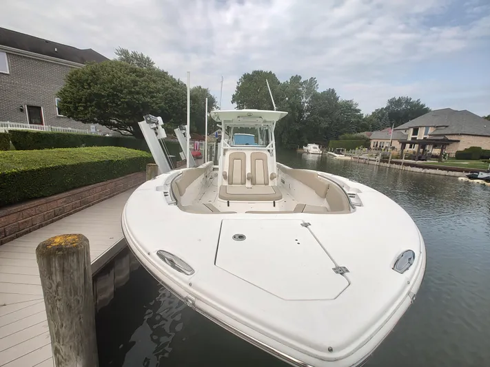  Yacht Photos Pics 2017 Sea Fox 328 Commander boat docked in a serene residential canal.