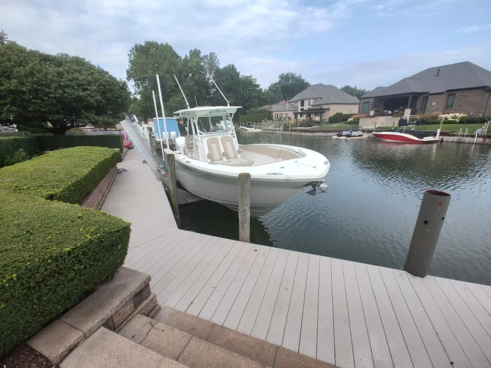  Yacht Photos Pics 2017 Sea Fox 328 Commander boat docked in a serene residential marina.