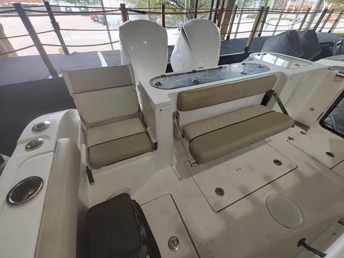  Yacht Photos Pics 2017 Sea Fox 328 Commander boat interior with seating and dual outboard motors.