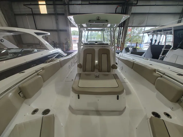  Yacht Photos Pics 2017 Sea Fox 328 Commander boat interior with seating and helm station in a showroom.