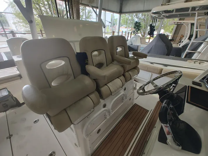  Yacht Photos Pics 2017 Sea Fox 328 Commander boat interior with beige seating and steering wheel.