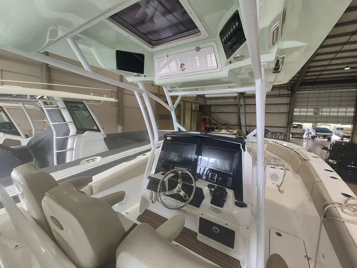  Yacht Photos Pics 2017 Sea Fox 328 Commander boat interior with dual helm seats and advanced navigation system.