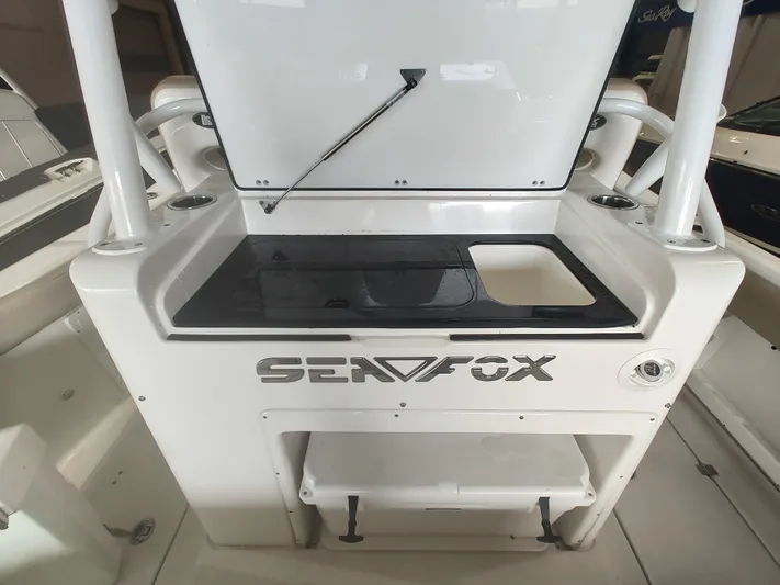  Yacht Photos Pics 2017 Sea Fox 328 Commander boat with open storage compartment and sleek design.