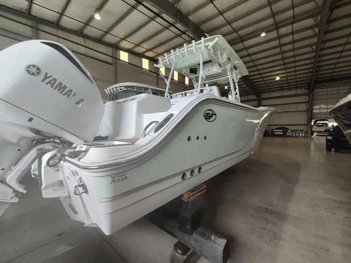  Yacht Photos Pics 2017 Sea Fox 328 Commander boat with Yamaha engine in a spacious indoor storage facility.