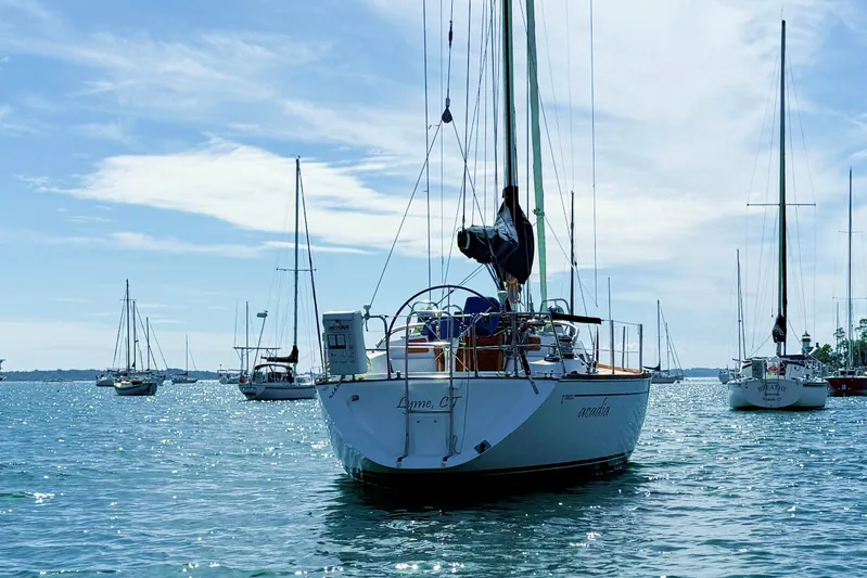 Acadia Yacht Photos Pics Sailboats anchored on a sunny day, featuring a 1997 Tartan 3800 model.