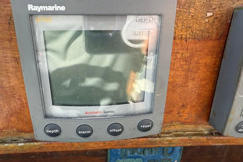 Acadia Yacht Photos Pics Raymarine ST60 display on 1997 Tartan 3800 sailboat, featuring depth, alarm, offset, and reset buttons.