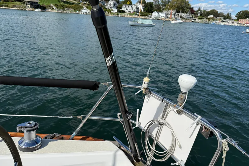 Acadia Yacht Photos Pics Sailboat deck view on water, Tartan 3800, 1997 model, with coastal background.