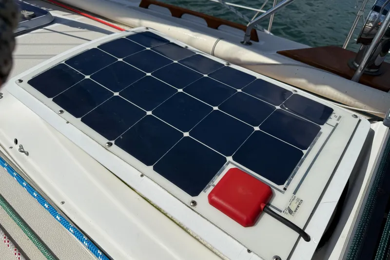 Acadia Yacht Photos Pics Solar panel on 1997 Tartan 3800 sailboat deck, harnessing renewable energy.