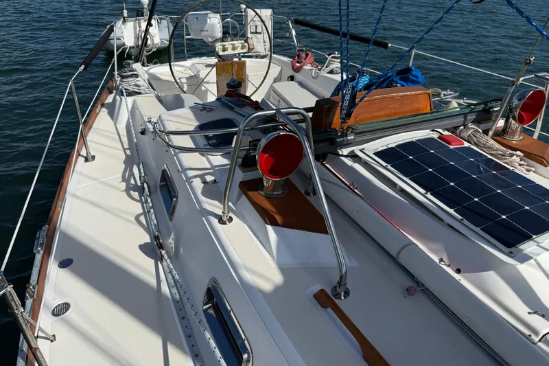 Acadia Yacht Photos Pics Sailboat deck of 1997 Tartan 3800 with solar panel and nautical equipment.