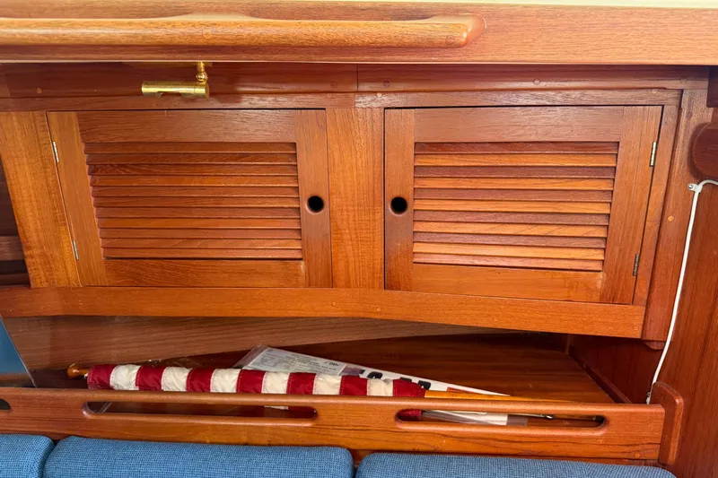 Acadia Yacht Photos Pics Wooden cabinet with louvered doors inside a 1997 Tartan 3800 sailboat.