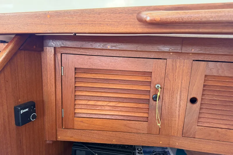 Acadia Yacht Photos Pics Wooden cabinet on a 1997 Tartan 3800 sailboat interior.