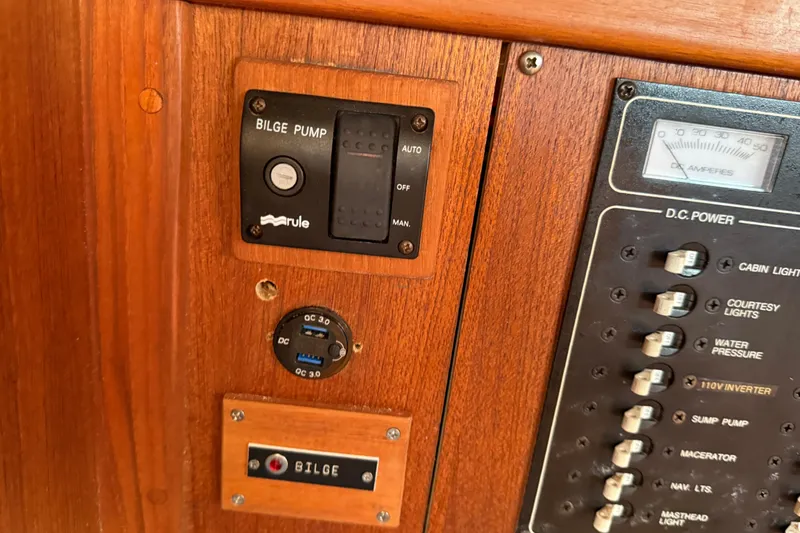 Acadia Yacht Photos Pics 1997 Tartan 3800 control panel with bilge pump and DC power switches.