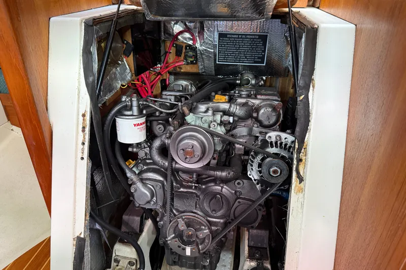 Acadia Yacht Photos Pics Engine compartment of a 1997 Tartan 3800 sailboat, featuring a Yanmar engine.
