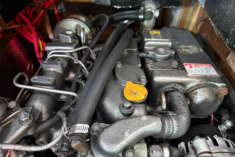 Acadia Yacht Photos Pics Engine compartment of a 1997 Tartan 3800, showcasing mechanical components and wiring.