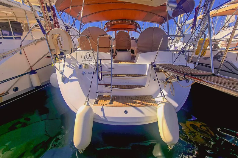  Yacht Photos Pics 2009 Jeanneau Sun Odyssey 50 DS yacht docked, showcasing rear deck and seating area.