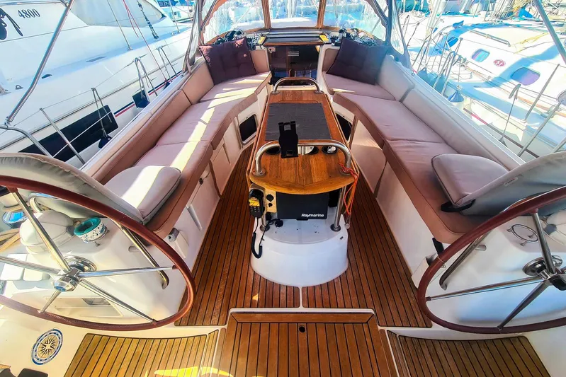  Yacht Photos Pics Luxurious 2009 Jeanneau Sun Odyssey 50 DS yacht cockpit with plush seating and dual steering wheels.