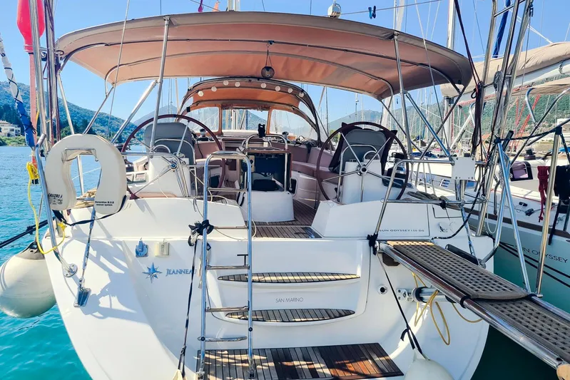  Yacht Photos Pics 2009 Jeanneau Sun Odyssey 50 DS sailboat docked, featuring spacious cockpit and elegant design.