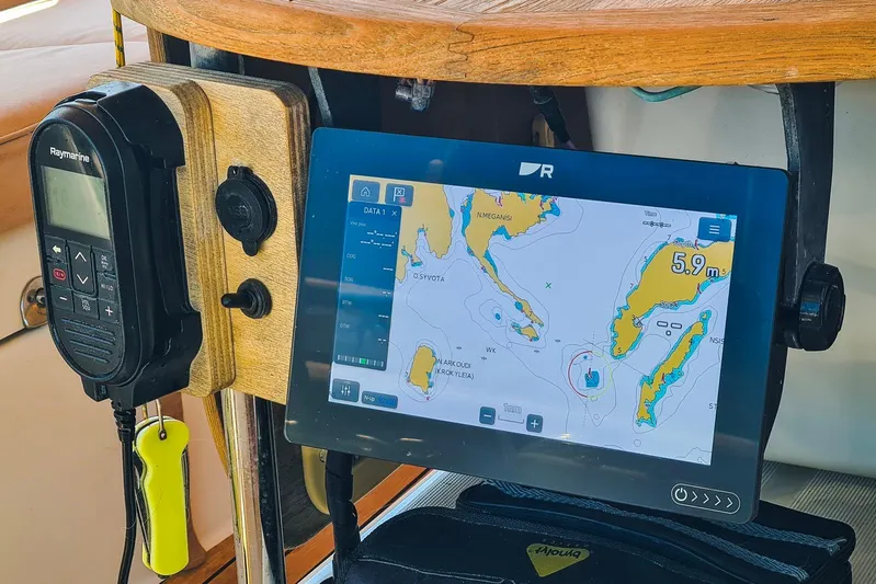  Yacht Photos Pics Navigation equipment on 2009 Jeanneau Sun Odyssey 50 DS sailboat, featuring Raymarine device and digital map.