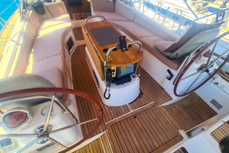  Yacht Photos Pics Cockpit of 2009 Jeanneau Sun Odyssey 50 DS with dual steering wheels and navigation equipment.