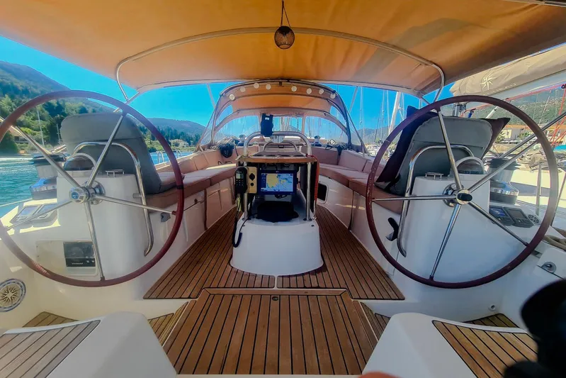  Yacht Photos Pics 2009 Jeanneau Sun Odyssey 50 DS yacht cockpit with dual steering wheels and navigation equipment.