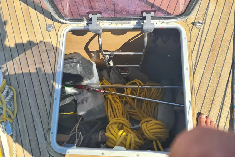  Yacht Photos Pics Storage compartment on 2009 Jeanneau Sun Odyssey 50 DS sailboat deck with ropes and equipment.