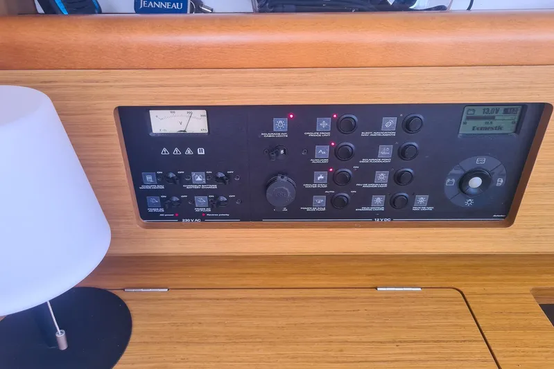  Yacht Photos Pics Control panel of a 2009 Jeanneau Sun Odyssey 50 DS sailboat, featuring various switches and gauges.