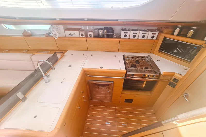  Yacht Photos Pics Luxurious 2009 Jeanneau Sun Odyssey 50 DS yacht kitchen with modern amenities.