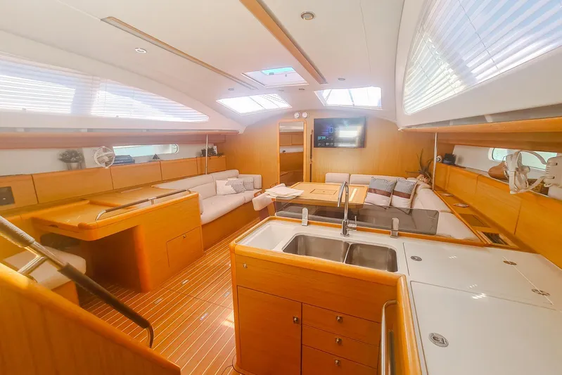  Yacht Photos Pics Luxurious interior of 2009 Jeanneau Sun Odyssey 50 DS yacht with modern amenities.