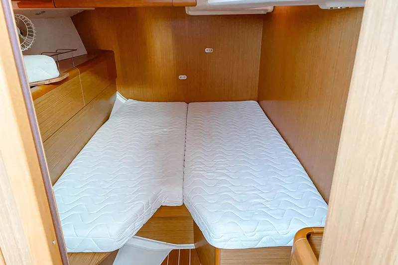 Yacht Photos Pics 2009 Jeanneau Sun Odyssey 50 DS cabin with twin beds and wooden interior.