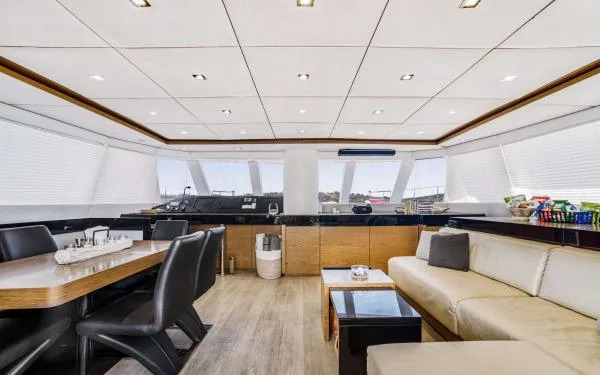 Euphoria Yacht Photos Pics Luxurious interior of 2016 Sunreef 60 LOFT yacht with modern seating and dining area.